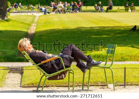 Paris, France - May 3, 2014: Tuileries Garden favorite place for walking and recreation tourists and residents. Located between the Louvre and the Place de la Concorde.