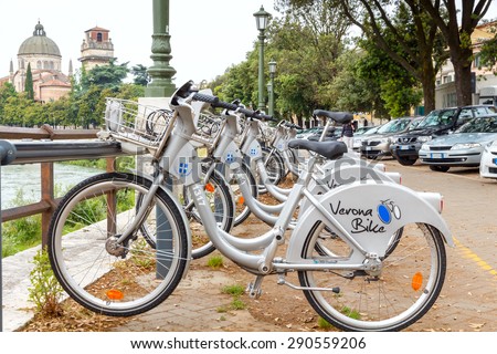 Verona, Italy - May 26, 2015: Rent a bike at the municipal quay Teodorico in Verona. Bicycles, as the most environmentally-friendly transport is widely used in the Italian cities.