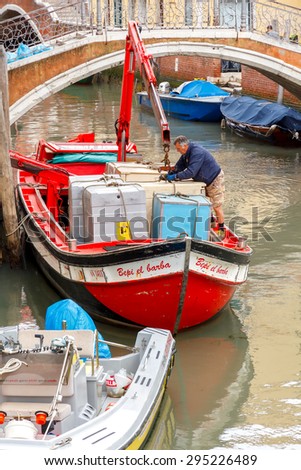 Venice, Italy - May 21 2015: Cargo Transportation Venice. All products and goods delivered to Venice carried on water transport by sea.