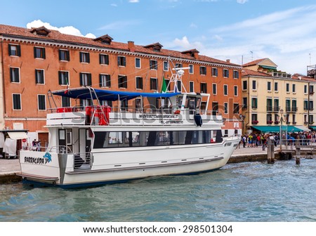 Venice, Italy - May 21, 2015: Pleasure boat tour around the main promenade of Venice. Boat trips for tourists are one of the main items of revenue to the city budget.