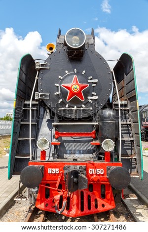 Brest, Belarus - July 12, 2015: Old steam locomotive parked. Coal-fired steam locomotives played a crucial role in the economy of the last century.