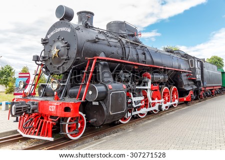 Brest, Belarus - July 12, 2015: Old steam locomotive parked. Coal-fired steam locomotives played a crucial role in the economy of the last century.