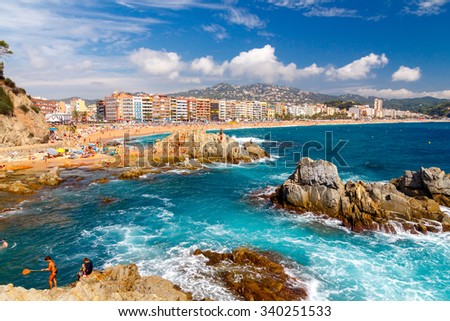 Lloret de Mar, Spain - September 13,  2015: A crowd of vacationers enjoy the warm beaches of the Costa Brava in Lloret de Mar. Lloret de Mar is one of the largest resorts on the coast of Spain.