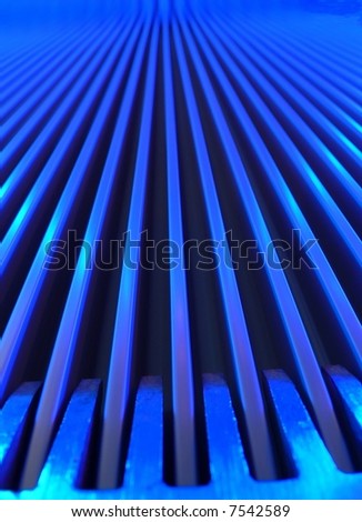 Close up ground floor view of a escalator with blue lighting