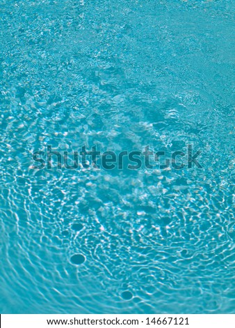 Blue water ripples in swimming pool
