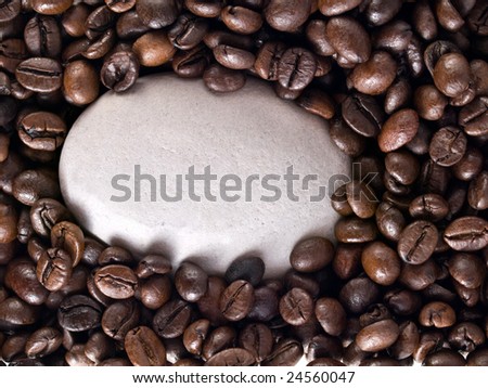 Zen stone on top of a bed of coffee beans