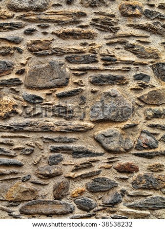 Texture rich stones of a house wall