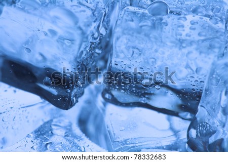 close up image of ice cubes under blue lighting