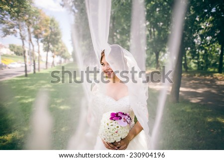 happy bride spinning around with veil