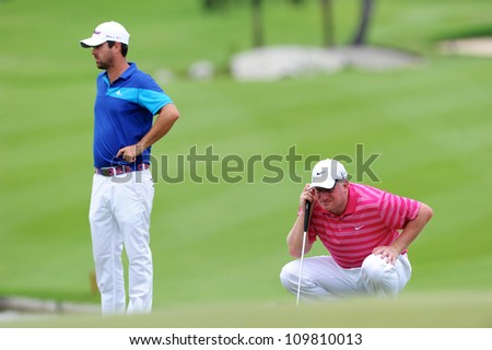 NAKHONPATHOM,THAILA ND - AUG 9:Richard Finch of ENG  lines up prior to putting during hole9 day one of the Golf Thailand Open at Suwan Golf&Country Club on August 9, 2012 in Nakhonpathom Thailand