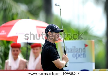 NAKHONPATHOM,THAILA ND - AUG 10:Scott Strange of AUS  watches the ball after hits a shot during day two of the Golf Thailand Open at Suwan Golf&Country Club on August 10, 2012 in Nakhonpathom Thailand
