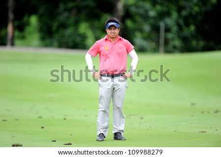 NAKHONPATHOM,THAILA ND-AUG 10:Wisut Artjanawat of THA watches lines up a shot during day two of the Golf Thailand Open at Suwan Golf&Country Club on August 10, 2012 in Nakhonpathom Thailand
