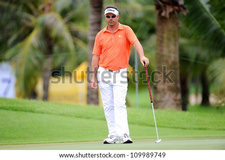 NAKHONPATHOM,THAILA ND-AUG 10: Andre Stolz of AUS watches the line up before hits a shot during day two of the Golf Thailand Open at Suwan Golf Club on August 10, 2012 in Nakhonpathom Thailand