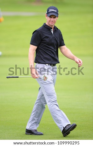 NAKHONPATHOM,THAILA ND - AUG 10:Scott Strange of AUS walks towards during hole9 day two of the Golf Thailand Open at Suwan Golf&Country Club on August 10, 2012 in Nakhonpathom Thailand