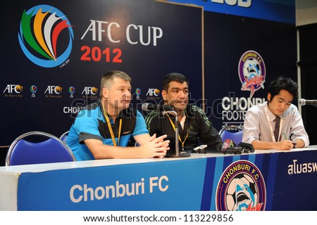 CHONBURI,THAILAND-SEP18:Valeriu Tita Manager (L)of Al Shorta (SYR) speaks to media after the match during AFC CUP between Chonburi fc.and Al Shorta (SYR) at Chonburi Stadium on Sep18,2012 in Thailand