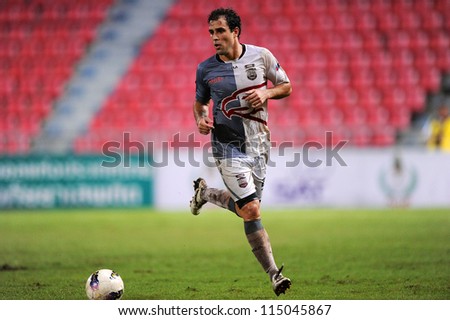 BANGKOK THAILAND-SEP15: Daniel Cortes of Insee Police Utd.(white) in action during Thai Premier League between BBCU F.C. and Insee Police Utd.at Rajamangala stadium on Sep15, 2012 in Thailand.