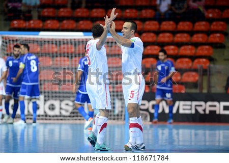 BANGKOK,THAILAND-NOVEMBER 06: Bojan Pavicevic (no.5)of Serbia celebrates with team mates during the FIFA Futsal World Cup between Kuwait and Serbia at Indoor Stadium Huamark on Nov6, 2012 in,Thailand.