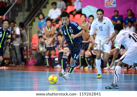 BANGKOK,THAILAND-NOVEMBER 07:Kotaro Inaba (blue) of Japan runs with the ball during the FIFA Futsal World Cup between Japan and Libya at Indoor Stadium Huamark on Nov7, 2012 in,Thailand.