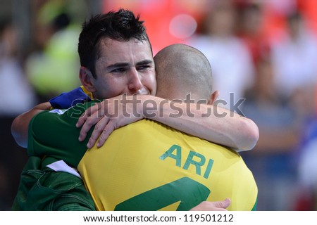 BANGKOK,THAILAND - NOVEMBER18:Neto of Brazil celebrates with team mate  the FIFA Futsal World Cup Final between Spain and Brazil at Indoor Stadium Huamark on Nov18, 2012 in ,Thailand.