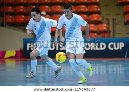 BANGKOK,THAILAND-NOV 09: Walter Enriquez of Guatemala (white) in action during the FIFA Futsal World Cup between Solomon Islands and Guatemala at Indoor Stadium Huamark on Nov9,2012 in,Thailand.