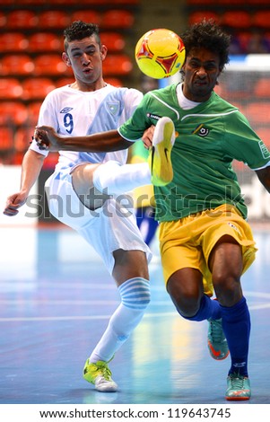 BANGKOK,THAILAND-NOV 09: Walter Enriquez of Guatemala (white) in action during the FIFA Futsal World Cup between Solomon Islands and Guatemala at Indoor Stadium Huamark on Nov9,2012 in,Thailand.