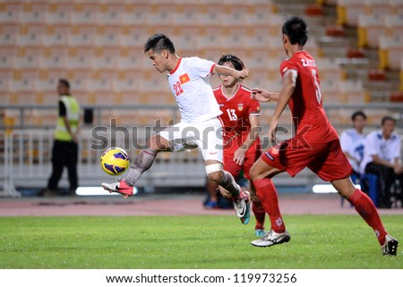 BANGKOK THAILAND-NOV 24:Au Van Hoan of Vietnam( white) runs with the ball during the AFF Suzuki Cup between Vietnam and Myanmar at Rajamangala stadium on Nov24, 2012 in Bangkok,Thailand.