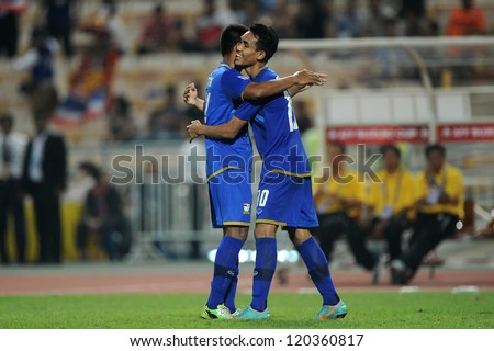 BANGKOK THAILAND-NOVEMBER 27:Teerasil Dangda (R) of Thailand celebrates with team mate during the AFF Suzuki Cup between Thailand and Myanmar at Rajamangala stadium on Nov27, 2012 in Bangkok,Thailand.