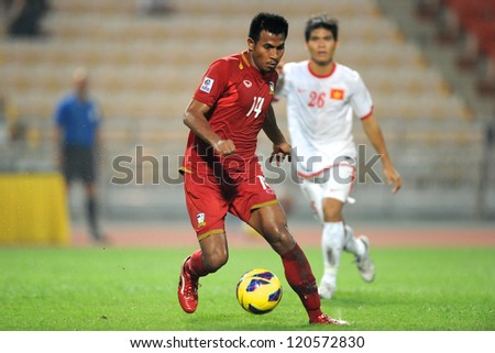 BANGKOK THAILAND-NOVEMBER 30:Sompong Soleb of Thailand (red) for the ball during the AFF Suzuki Cup between Vietnam and Thailand at Rajamangala stadium on Nov30, 2012 in Bangkok,Thailand.