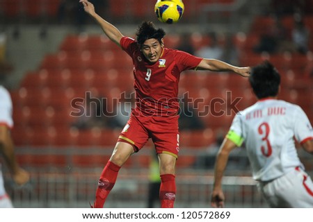 BANGKOK THAILAND-NOVEMBER 30:Kirati Keawsombut of Thailand (red) in action during the AFF Suzuki Cup between Vietnam and Thailand at Rajamangala stadium on Nov30, 2012 in Bangkok,Thailand.