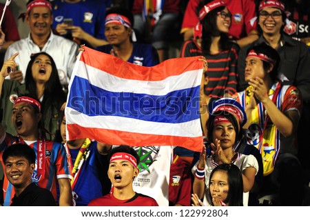 BANGKOK THAILAND-DECEMBER 13:Unidentified of Thailand Flag supporters during the AFF Suzuki Cup between  Malaysia and Thailand at Supachalasai stadium on Dec13, 2012 in,Thailand.