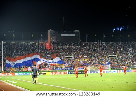 BANGKOK THAILAND-DECEMBER 13:nidentified fans of Thailand Flag supporters  during the AFF Suzuki Cup between Malaysia and Thailand at Supachalasai stadium on Dec13,2012 in Bangkok,Thailand.