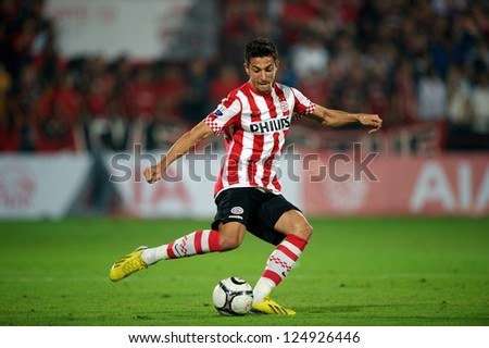 BANGKOK,THAILAND-JANUARY 8: 	Stanislav Manolev (RED) of PSV in action during The AIA Champions Cup match between SCG Muangthong Utd. and PSV at SCG Stadium on Jan8 ,2012 in ,Thailand.