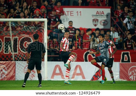 BANGKOK,THAILAND-JANUARY 8: Mathias Jrgensen (RED) of PSV in action during The AIA Champions Cup match between SCG Muangthong Utd. and PSV at SCG Stadium on Jan8 ,2012 in ,Thailand.