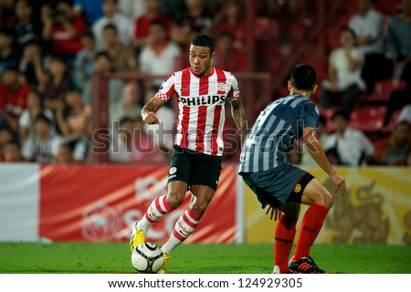 BANGKOK,THAILAND-JANUARY 8: Memphis Depay (RED) of PSV in action during The AIA Champions Cup match between SCG Muangthong Utd. and PSV at SCG Stadium on Jan8 ,2012 in ,Thailand.