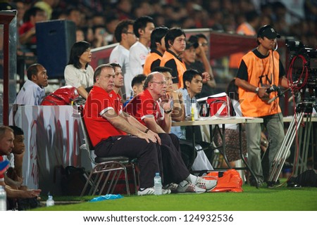 BANGKOK,THAILAND-JANUARY 8: Coach	Dick Advocaat of PSV look on during The AIA Champions Cup match between SCG Muangthong Utd. and PSV at SCG Stadium on Jan8 ,2012 in ,Thailand.