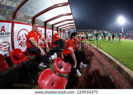 BANGKOK,THAILAND-JANUARY 8:Coach	Dick Advocaat (L) of PSV in action during The AIA Champions Cup match between SCG Muangthong Utd. and PSV at SCG Stadium on Jan8 ,2012 in ,Thailand.
