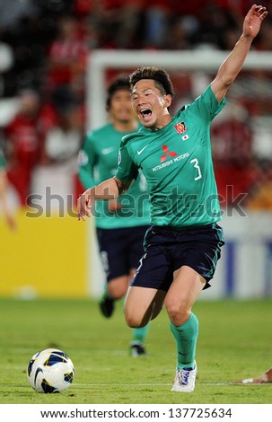 NONTHABURI,THAILAND-MAY01:Tomoya Ugajin of Urawa Red Diamonds in action during the AFC Champions League between Muangthong Utd.and Urawa Red Diamonds at SCG Stadium on May1,2013 in,Thailand.