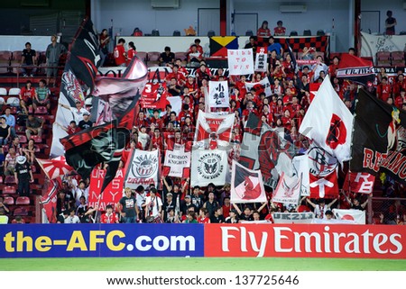 NONTHABURI,THAILAND-MAY 01:Unidentified of Urawa Red Diamonds Flag supporters during the AFC Champions League between Muangthong Utd.and Urawa Red Diamonds at SCG Stadium on May 1,2013 in,Thailand.