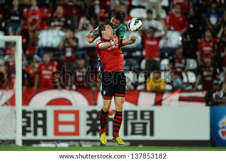 NONTHABURI,THAILAND-MAY01:Roland Linz (red) of Muangthong Utd. in action during the AFC Champions League between Muangthong Utd.and Urawa Red Diamonds at SCG Stadium on May1,2013 in,Thailand.