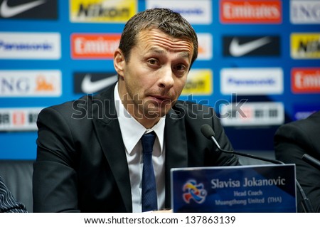GUANGZHOU,CHINA-APRIL 03:	Head coach Slavisa Jokanovic of MTUTD speaks during after match the AFC Champions League between Guangzhou Evergrande and MTUTD at Tianhe Stadium on April 3,2013 in,China.