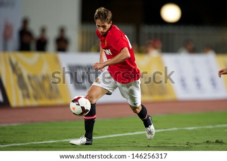 BANGKOK,THAILAND-JULY13: Adnan Januzaj of Manchester United run with the ball during the friendly match between Singha All Star and Manchester United at Rajamangala Stadium on July13,2013in Thailand.
