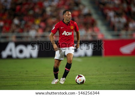 BANGKOK,THAILAND-JU LY13: Ryan Giggs of Manchester United in action during the friendly match between Singha All Star XI and Manchester United at Rajamangala Stadium on July 13, 2013 in Thailand.