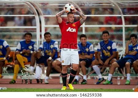 BANGKOK THAILAND-JULY13:Alexander Buttner of Manchester United in action during the friendly match between Singha All Star XI and Manchester United at Rajamangala Stadium on July13,2013 in Thailand.