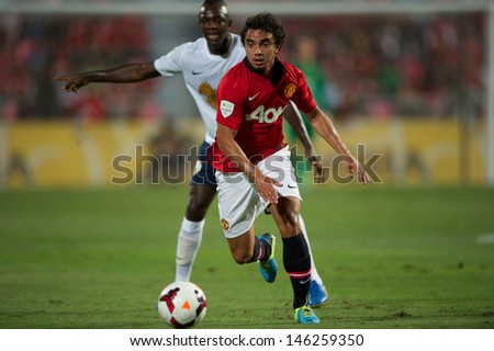 BANGKOK THAILAND-JULY13:Fabio Da Silva (R) of Manchester United in action during the friendly match between Singha All Star XI and Manchester United at Rajamangala Stadium on July13,2013 in Thailand.