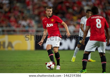 BANGKOK THAILAND-JULY13:Michael Carrick of Manchester United in action during the friendly match between Singha All Star XI and Manchester United at Rajamangala Stadium on July13,2013 in Thailand.