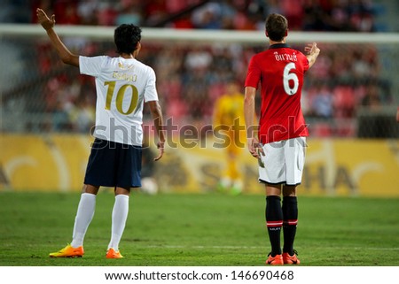 BANGKOK THAILAND-JULY13:Teerasil Dangda (L)of Singha All Star XI in action during the friendly match between Singha All Star XI and Manchester United at Rajamangala Stadium on July13,2013 in Thailand.