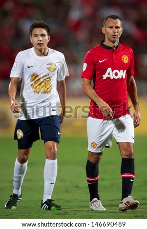 BANGKOK THAILAND-JULY13:Ryan Giggs (R) of Manchester United look on during the friendly match between Singha All Star and Manchester United at Rajamangala Stadium on July13,2013 in Thailand.