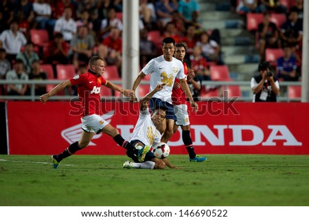 BANGKOK THAILAND-JULY13:Tom Cleverley(L) of Manchester United look on during the friendly match between Singha All Star and Manchester United at Rajamangala Stadium on July13,2013 in Thailand.