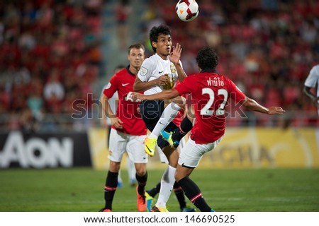 BANGKOK THAILAND-JULY13:Teerasil Dangda (C)of Singha All Star XI in action during the friendly match between Singha All Star XI and Manchester United at Rajamangala Stadium on July13,2013 in Thailand.