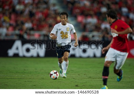 BANGKOK THAILAND-JULY13:Datsakorn Thonglao of Singha All Star XI in action during the friendly match between Singha All Star XI and Manchester United at Rajamangala Stadium on July13,2013 in Thailand.